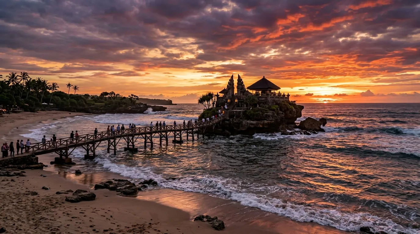 Pemandangan pantai Malang selatan dengan tebing karang dan ombak dramatis yang cocok untuk konten kreator